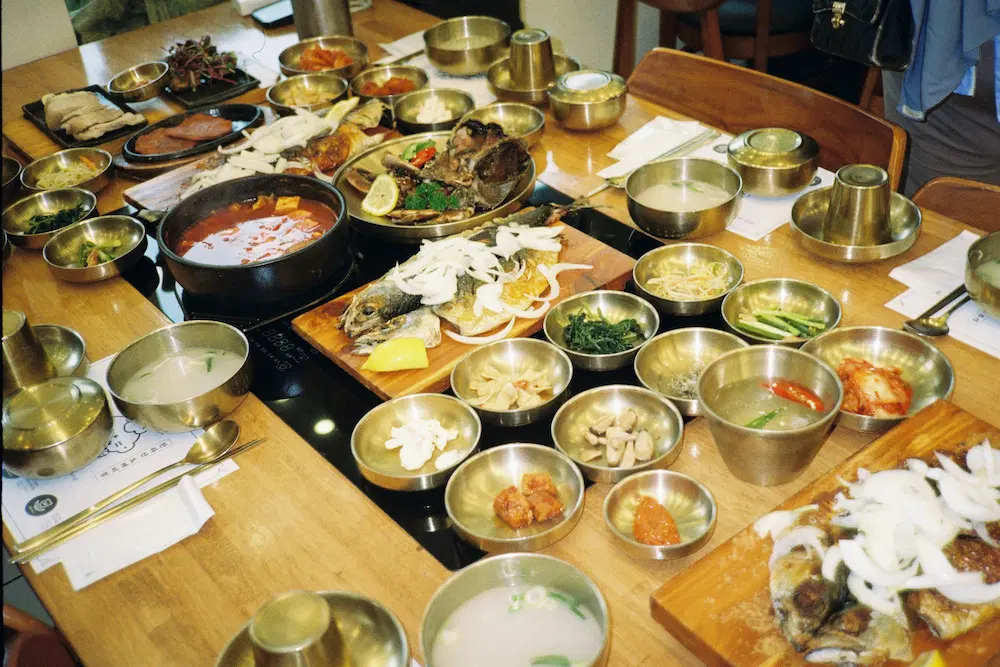 a lot of side dishes in a korean restaurant